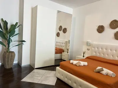 Letto o letti in una camera di Le residenze del mare 2 Camera con cucina