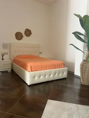 Letto o letti in una camera di Le residenze del mare 2 Camera con cucina
