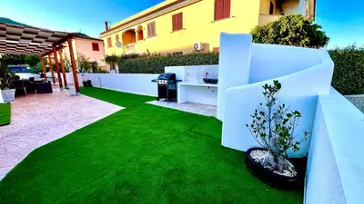 Giardino di Le residenze del mare 2 Camera con cucina