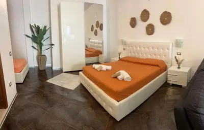 Letto o letti in una camera di Le residenze del mare 2 Camera con cucina
