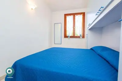 Letto o letti in una camera di Grosseto Bilo