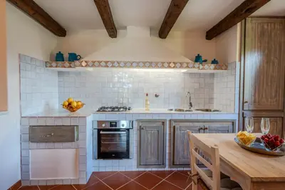 Cucina o angolo cottura di Villa Capo Coda Cavallo piscina privata