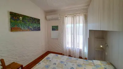 Letto o letti in una camera di Appartamento Residenziale Trilocale 4 posti letto via Loiri