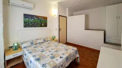 Letto o letti in una camera di Appartamento Residenziale Trilocale 4 posti letto via Loiri