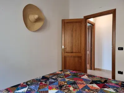 Letto o letti in una camera di Residenze S'ABBAIDA - BUDONI SWEET HOME