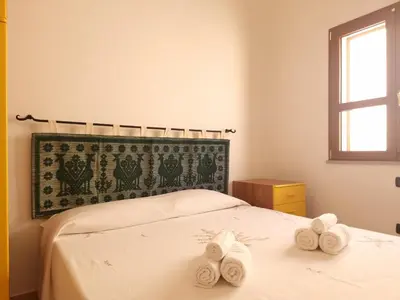 Letto o letti in una camera di Residenze S'ABBAIDA - BUDONI SWEET HOME