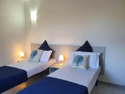 Letto o letti in una camera di Villette Miramare