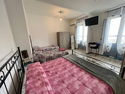 Letto o letti in una camera di Casa Tziu Predu - Centro Nuoro - B&Brothers