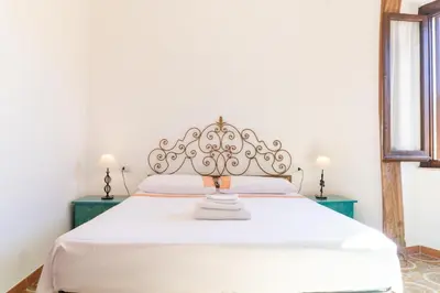 Letto o letti in una camera di Casa Ombrina