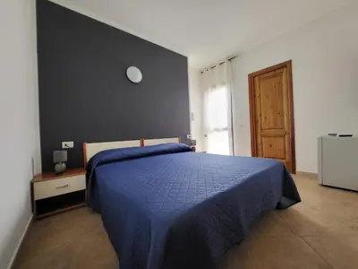 Letto o letti in una camera di White Sand affittacamere