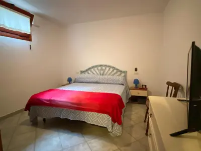 Letto o letti in una camera di Casa Rosa