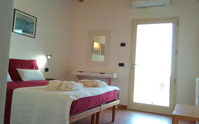 Letto o letti in una camera di B&B Andrieddu