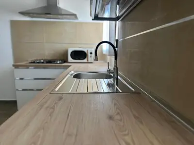 Cucina o angolo cottura di La Caletta Comfort - Wi-Fi, AC, parcheggio