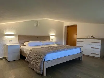 Letto o letti in una camera di La Caletta Comfort - Wi-Fi, AC, parcheggio