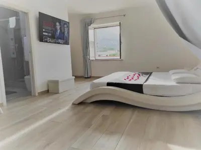 Letto o letti in una camera di Guest House - La bella vita
