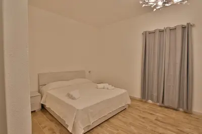 Letto o letti in una camera di Les Chambres Au Centre
