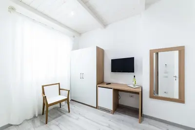 TV o dispositivi per l'intrattenimento presso La Promenade Rooms & Suites