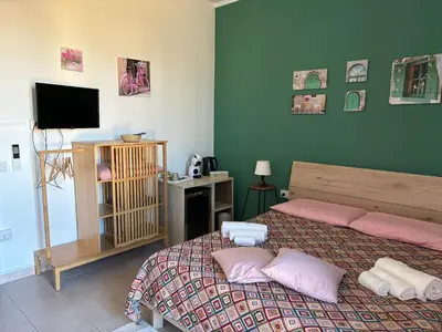Letto o letti in una camera di Assajè Guestroom