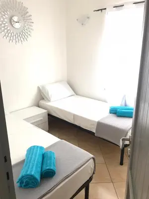 Letto o letti in una camera di International House San Teodoro
