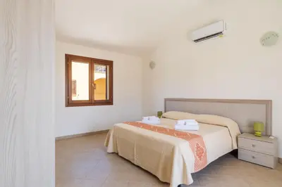 Letto o letti in una camera di Residence Corte di Gallura