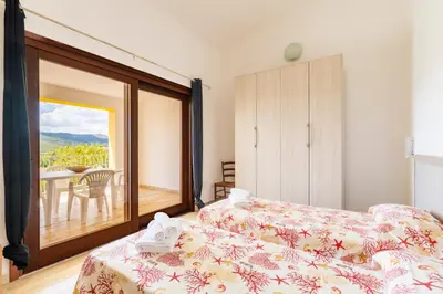 Letto o letti in una camera di Residence Corte di Gallura