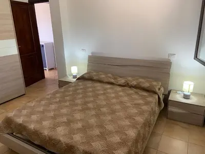 Letto o letti in una camera di Le Villette di Budoni e dintorni