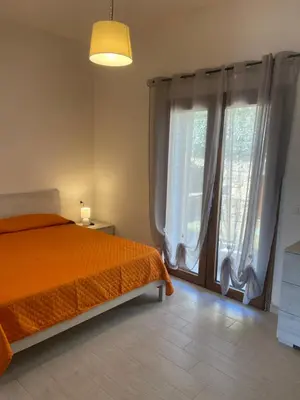 Letto o letti in una camera di Le Villette di Budoni e dintorni