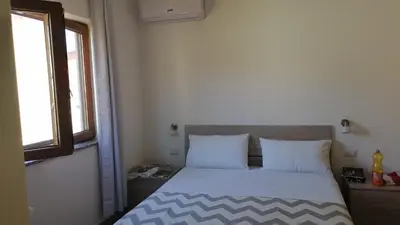 Letto o letti in una camera di Affittacamere Sos Ninnitteddos