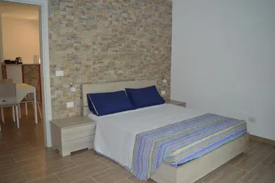Letto o letti in una camera di Affittacamere Sos Ninnitteddos