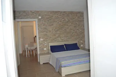 Letto o letti in una camera di Affittacamere Sos Ninnitteddos