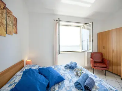 Letto o letti in una camera di Apartment in Cala Gonone by Dolce Acqua Cliff