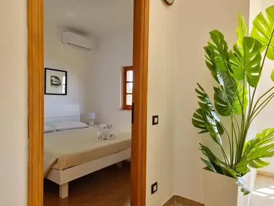 Letto o letti in una camera di Villa Papiyon - Accesso privato alla spiaggia