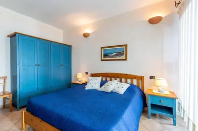 Letto o letti in una camera di APARTMENT PIED DANS L'EAU