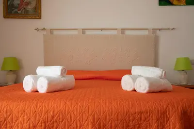 Letto o letti in una camera di Le Residenze di Baia Sant'Anna