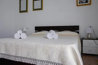 Letto o letti in una camera di Le Residenze di Baia Sant'Anna