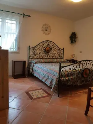Letto o letti in una camera di Villa Su Trechesu