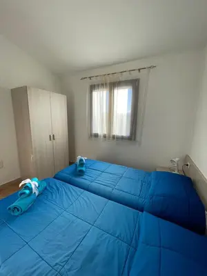 Letto o letti in una camera di Case Vacanza Onda e Riva