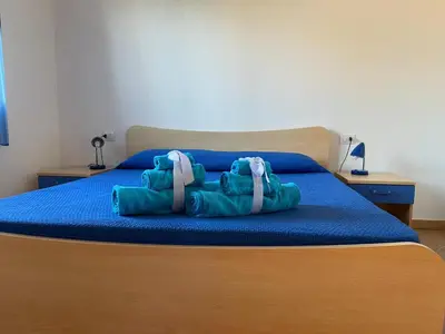 Letto o letti in una camera di Case Vacanze Sole e Luna