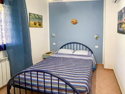 Letto o letti in una camera di Casa Carola Quadrilocale 4 posti letto