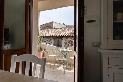 Balcone o terrazza di Domo Mea Terra e Domo Mea Chelu - Comfort nel centro storico di Orosei