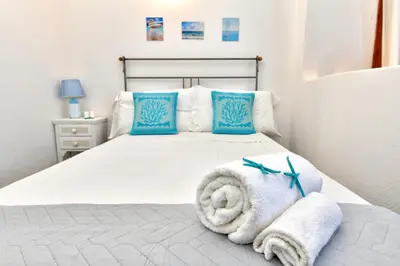 Letto o letti in una camera di Residence Chiaro di Luna
