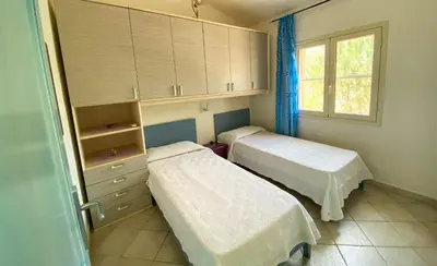 Letto o letti in una camera di Santu Juanne -Ammentos Posada- a due passi dalla spiaggia
