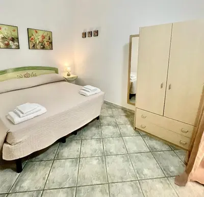 Letto o letti in una camera di Prima Spiaggia Apartments
