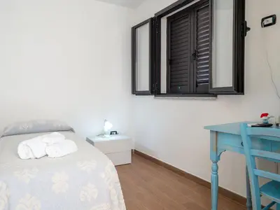 Letto o letti in una camera di Affittacamere Zia Maria