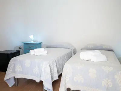 Letto o letti in una camera di Affittacamere Zia Maria