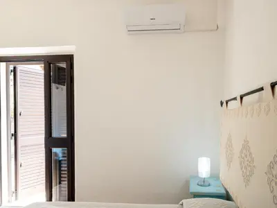 Letto o letti in una camera di Affittacamere Zia Maria