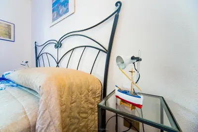 Letto o letti in una camera di Casa Fendemare, vista sul golfo IUNQ2620