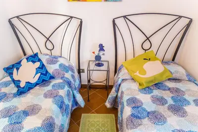 Letto o letti in una camera di Casa Fendemare, vista sul golfo IUNQ2620