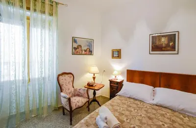Letto o letti in una camera di Casa Marta IUN Q1985