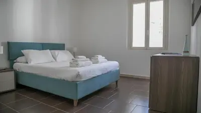 Letto o letti in una camera di Luminosa - Cala Gonone